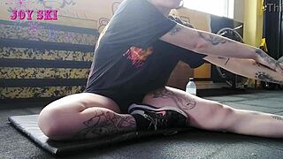 hey, check out this alternative girl stretching her sexy body at the gym