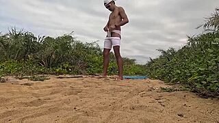 handjob and cumshot action right on the beach