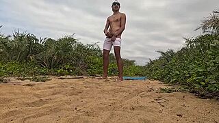 handjob and cumshot action right on the beach