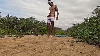 handjob and cumshot action right on the beach