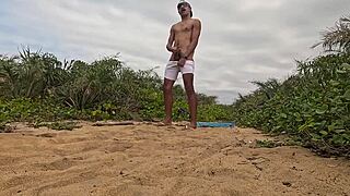 handjob and cumshot action right on the beach