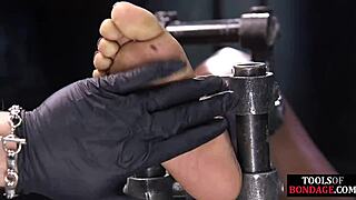 ebony bdsm slave tied tight gagging on toes in foot domination session