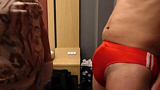 sadistic bitch slaps bulging cock thru tight bloomers