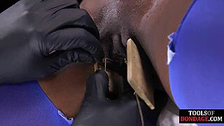 ebony bdsm slave tied tight gagging on toes in foot domination session