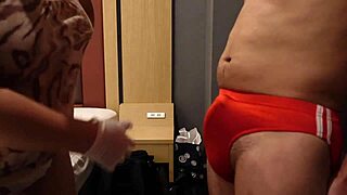 sadistic bitch slaps bulging cock thru tight bloomers