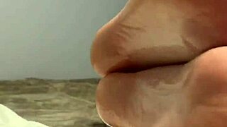 oiled milf spreads toes wide, begging for fetish foot worship on her scrunched soles