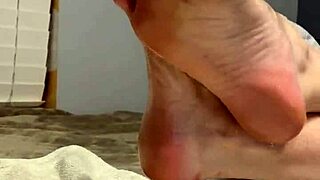 oiled milf spreads toes wide, begging for fetish foot worship on her scrunched soles