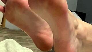 oiled milf spreads toes wide, begging for fetish foot worship on her scrunched soles