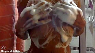 ginger gets her soapy wet nipples and tits up close with belly tease