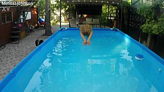 Melissa lounges as tattooed milf mermaid by pool with brown eyes