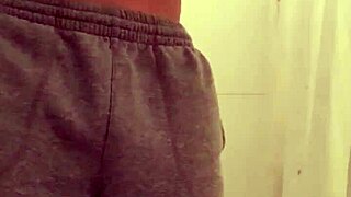 guy strokes his throbbing cock sensually while showering with steamy water cascading down