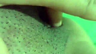 mature alone at home fingers her smooth shaved pussy