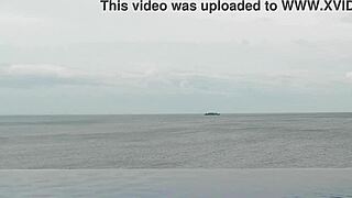 college japanese princess skinny with ponytail relaxes at infinity pool