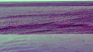 college japanese princess skinny with ponytail relaxes at infinity pool