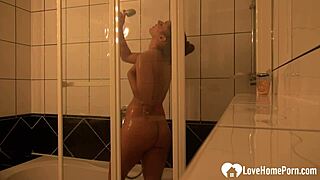Watch this slutty brunette tease in shower for her man's camera?