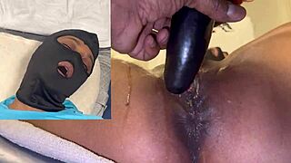 masked ebony chick grinds dildo till pussy squirts rivers close-up