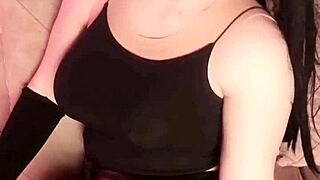Goth shemale ladyboy in leather skirt shakes her pale big ass for crossdressing tease