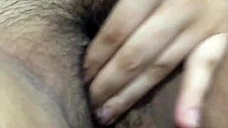 Asian babe masturbates tight pussy right after work moaning softly