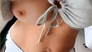 housewife slips open her shirt for playful tit flashing tease around the house
