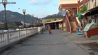 Woman strolls nude through busy public streets
