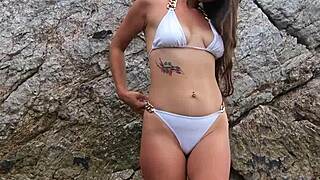 Does white bikini public dance by tanned beach beauty tempt you?