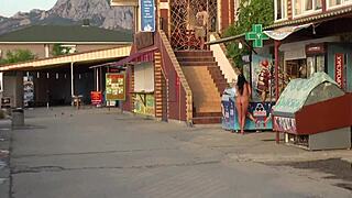 Woman strolls nude through busy public streets