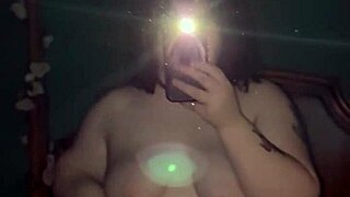 chubby goth girl teases her curves slowly