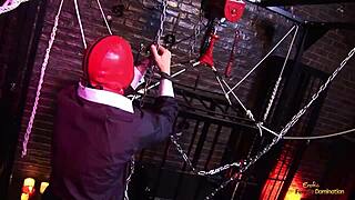 two masked mistresses bound in latex endure rough double penetration in sex dungeon