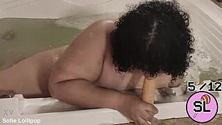 trans hottie plays with herself in the hot tub massage vibes