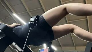 Girl cums hard fingering fat tits in public gym