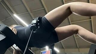 Girl cums hard fingering fat tits in public gym