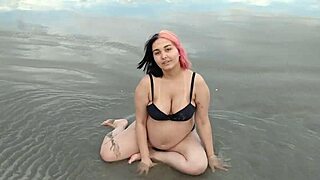 pregnant african teen belinha sensually poses her big belly on beach