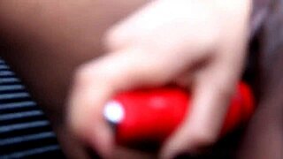 Jayla Foxx plays with her red toy inside a pickup truck