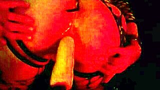 mature babe's shaved asshole gapes wide on anal fuck machine in fishnets