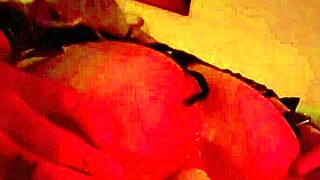 mature babe's shaved asshole gapes wide on anal fuck machine in fishnets