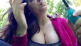 nicoletta smokes in garden flashing her huge tits casually
