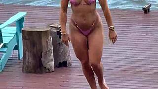 she slips into a daring micro bikini for the beach