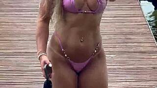 she slips into a daring micro bikini for the beach