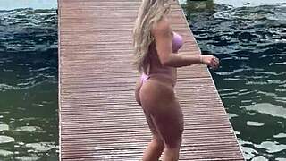 she slips into a daring micro bikini for the beach