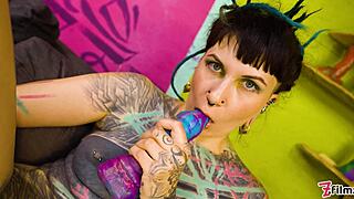 tattooed goth teen shoves toys deep in pussy and gaping ass