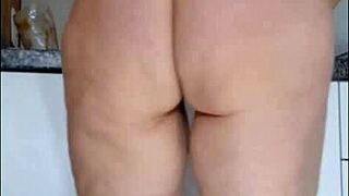 a hidden camera catches the stepmom in the kitchen wearing just panties and a see-through blouse