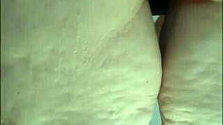 a hidden camera catches the stepmom in the kitchen wearing just panties and a see-through blouse