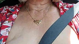 hey watch me ride down the road flashing my huge housewife tits out