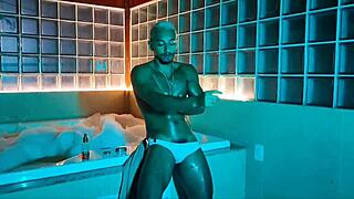 Muscular Black Bodybuilder Strokes Monster Cock in Foamy Bathtub