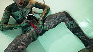 Heavily Tattooed Model Fingers Gaping Asshole in Steamy Shower