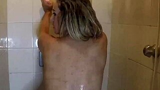 Brunette sucks while blonde gets wet in shower