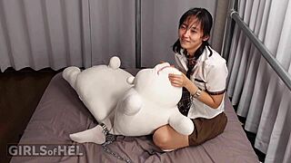 Chained Asian Cutie Teases Pussy To Orgasm