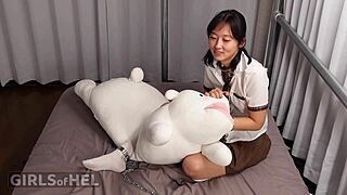 Chained Asian Cutie Teases Pussy To Orgasm