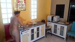 naked housekeeper cooks in the kitchen