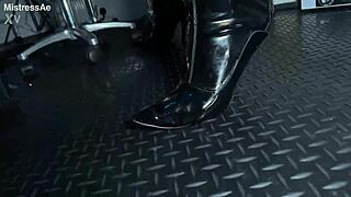 solo 1 showcasing studio black latex catsuit and huge red cobra strap-on